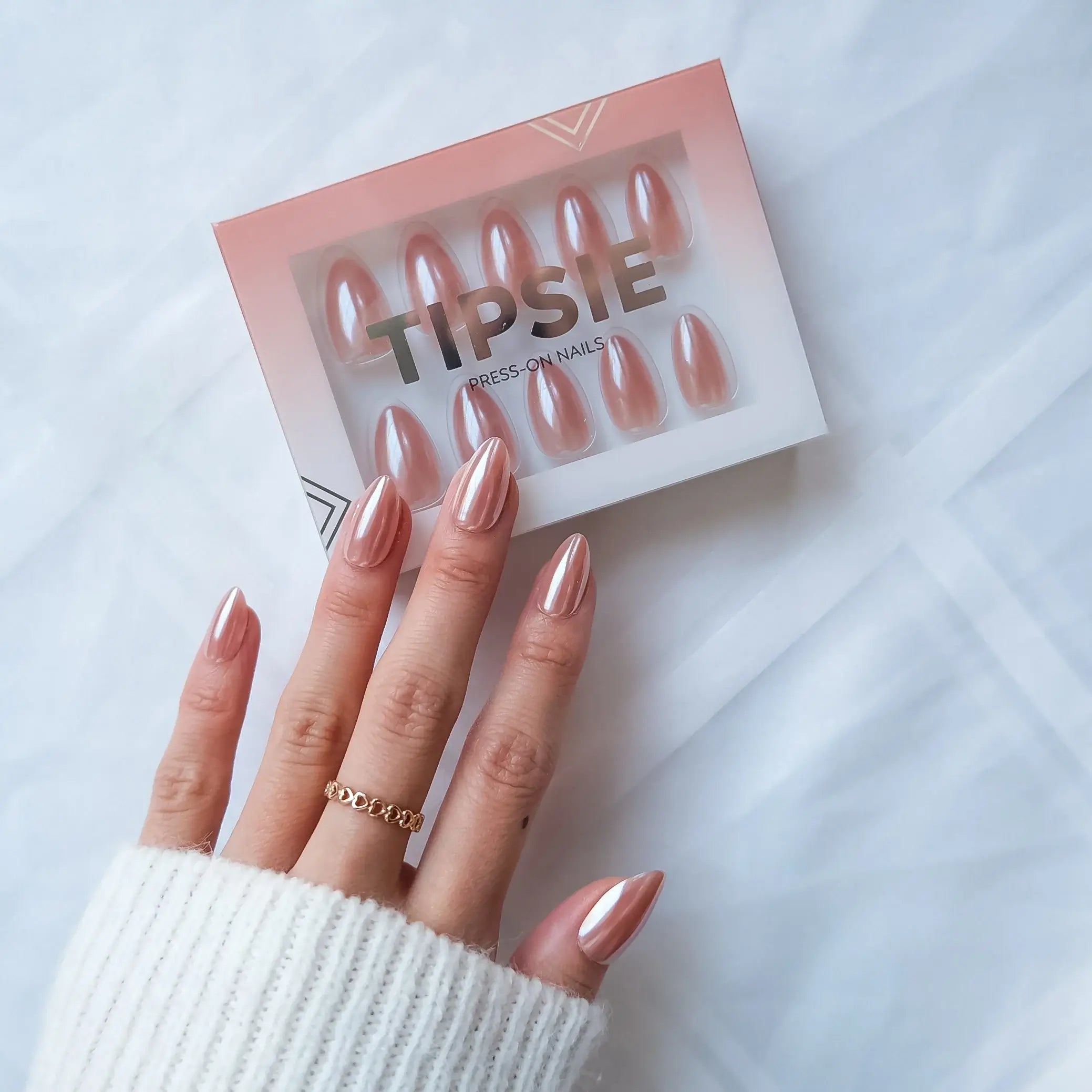 Set of press-on nails with 'TIPSIE' packaging on a white background